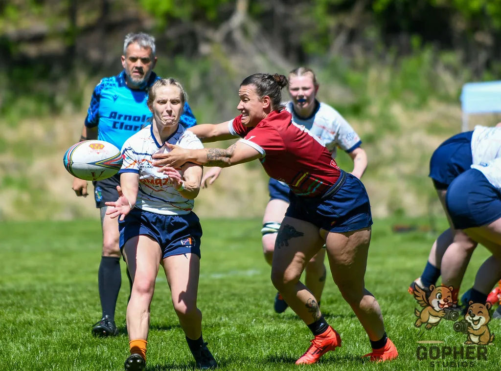 Rugby players competing for the ball during a match.